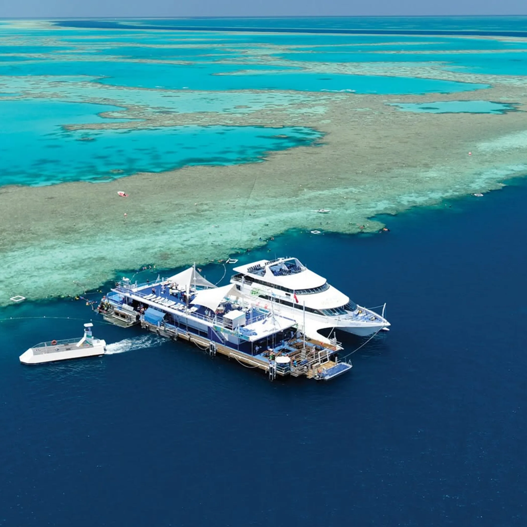 boats on clear reef water